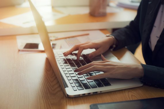 Working in the office using the work computer.