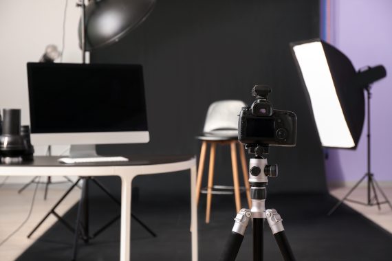 Modern camera and equipment in photo studio